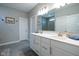 Spacious bathroom featuring double sinks with quartz countertops, modern fixtures, and a large mirror at 9741 Haughton Ln, McCordsville, IN 46055