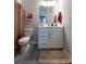 This bathroom has a modern vanity with drawers and a contrasting rug over grey floors at 9741 Haughton Ln, McCordsville, IN 46055