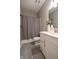 Cozy bathroom featuring a shower with gray curtain, neutral walls, stylish vanity, and tiled floor at 9741 Haughton Ln, McCordsville, IN 46055