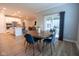 Open dining area features a round table, view of kitchen, and a sliding glass door to the outdoor space at 9741 Haughton Ln, McCordsville, IN 46055