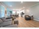 Spacious living area showcasing hardwood floors, an open concept, and plenty of natural light at 9741 Haughton Ln, McCordsville, IN 46055