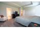 Spacious main bedroom features carpeted floors, a dresser, chair and an attached bathroom at 9741 Haughton Ln, McCordsville, IN 46055