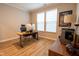 Bright home office space with wood floors, natural light, and modern furnishings at 9741 Haughton Ln, McCordsville, IN 46055