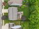 Aerial view of a home with a large backyard, patio spaces, mature trees, and well-manicured landscaping at 9756 Brook Meadow Dr, McCordsville, IN 46055