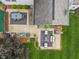 Aerial view showcasing the home's patio area with outdoor seating, lush landscaping, and well-maintained lawn at 9756 Brook Meadow Dr, McCordsville, IN 46055