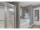 Bathroom featuring a stand up shower and soaking tub next to the door at 9756 Brook Meadow Dr, McCordsville, IN 46055