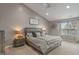 Comfortable main bedroom with a ceiling fan, vaulted ceiling, and large windows at 9756 Brook Meadow Dr, McCordsville, IN 46055