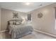Bedroom with a cozy gray interior design and abundant natural light at 9756 Brook Meadow Dr, McCordsville, IN 46055