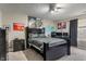 Large bedroom with a dark colored bed, posters, and a large work desk at 9756 Brook Meadow Dr, McCordsville, IN 46055