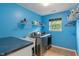 Laundry room with washer and dryer machines, a utility sink, and blue walls at 9756 Brook Meadow Dr, McCordsville, IN 46055