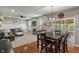 Open floor plan showcasing a spacious living room with a fireplace and views of the dining area at 9756 Brook Meadow Dr, McCordsville, IN 46055
