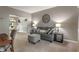 Comfortable living room featuring neutral tones and plush seating, creating an inviting atmosphere at 9756 Brook Meadow Dr, McCordsville, IN 46055