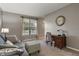 Cozy living room area with a large window providing ample natural light and a comfortable seating arrangement at 9756 Brook Meadow Dr, McCordsville, IN 46055