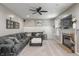 Comfortable living room features a fireplace, a large sectional, and stylish decor at 9756 Brook Meadow Dr, McCordsville, IN 46055