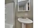 Bathroom with tub, shower and pedestal sink at 988 Westfield Rd, Noblesville, IN 46062