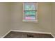 Bedroom view with natural light, neutral walls, carpet, and view to the exterior deck at 988 Westfield Rd, Noblesville, IN 46062