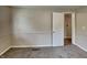 Bedroom with neutral walls, carpet, window with natural light, and a doorway to the hall at 988 Westfield Rd, Noblesville, IN 46062
