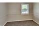 Bedroom with neutral walls, carpet, window with natural light, and traditional trim at 988 Westfield Rd, Noblesville, IN 46062
