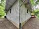 Rear exterior view of home with white siding and a red deck at 988 Westfield Rd, Noblesville, IN 46062