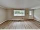 Inviting living room with light-filled window and durable wood-look flooring at 988 Westfield Rd, Noblesville, IN 46062