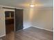 View of the Living Room and doorway to Kitchen area with stylish barn door and hard surface flooring at 988 Westfield Rd, Noblesville, IN 46062