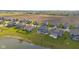 Home near a pond with a black fence and large backyard, aerial view at 9917 Gallop Ln, Fishers, IN 46040