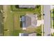 A high angle view of the house highlighting the yard, patio, and proximity to the water at 9917 Gallop Ln, Fishers, IN 46040