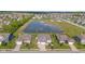 Aerial view of a suburban home next to a community lake at 9917 Gallop Ln, Fishers, IN 46040