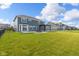 Large, well-maintained backyard features a patio and black metal fence at 9917 Gallop Ln, Fishers, IN 46040