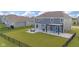 A full view of the backyard, featuring a patio, pergola, and well-maintained lawn at 9917 Gallop Ln, Fishers, IN 46040