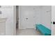 Spacious bathroom with a large shower and a blue bench at 9917 Gallop Ln, Fishers, IN 46040