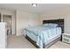 Bright bedroom with bed, dark wood headboard, and adjoining doorway at 9917 Gallop Ln, Fishers, IN 46040