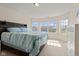 Bright bedroom with bed facing bay window; large white dresser at 9917 Gallop Ln, Fishers, IN 46040