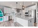 Bright and airy kitchen featuring white cabinets, stainless steel appliances, and granite countertops at 9917 Gallop Ln, Fishers, IN 46040