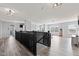 Large loft area boasting wood floors and ample space for entertaining at 9917 Gallop Ln, Fishers, IN 46040