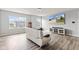 Relaxing loft with comfortable seating, a built-in entertainment center, and bright windows at 9917 Gallop Ln, Fishers, IN 46040