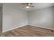 Spacious room with light gray walls and modern ceiling fan fixture at 1002 Collier St, Indianapolis, IN 46241