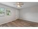 Bright bedroom with a ceiling fan, natural light, and new floors at 1002 Collier St, Indianapolis, IN 46241