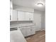 Clean and updated kitchen with white cabinets, modern hardware, and durable countertops at 1002 Collier St, Indianapolis, IN 46241