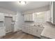 Well-lit kitchen with white cabinetry, ample counter space, and modern fixtures at 1002 Collier St, Indianapolis, IN 46241