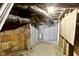 Unfinished basement features block walls, exposed ductwork, and wood supports at 1021 W 37Th St, Indianapolis, IN 46208