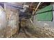 Basement crawlspace with exposed ductwork and old brick with a little bit of water damage at 1021 W 37Th St, Indianapolis, IN 46208