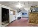 Spacious basement features painted walls, drop ceiling and includes a small sink at 1021 W 37Th St, Indianapolis, IN 46208
