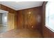 Wood paneled bedroom with one window at 1021 W 37Th St, Indianapolis, IN 46208