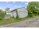 Detached garage with a classic roll-up door, adjacent to a home at 1021 W 37Th St, Indianapolis, IN 46208