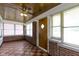 Enclosed sunroom featuring brick accents, checkered tile floor, and multiple windows for natural light at 1021 W 37Th St, Indianapolis, IN 46208