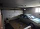 Attached garage featuring one car with automatic opener and side storage space for tools or equipment at 10307 Orchard Park S Dr, Carmel, IN 46280