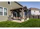 Inviting backyard patio with an open pergola, grill, and outdoor seating for relaxing or entertaining at 1065 Park Ct, Avon, IN 46123