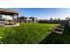 Large backyard features a pergola covered patio, a grill, and raised garden beds at 1065 Park Ct, Avon, IN 46123