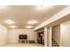 Finished basement area featuring carpet, recessed lighting, shelving, and staircase to another level to a cozy space at 1065 Park Ct, Avon, IN 46123